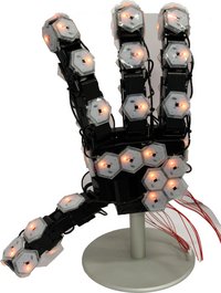 A photo of the robot hand with 4 fingers. 